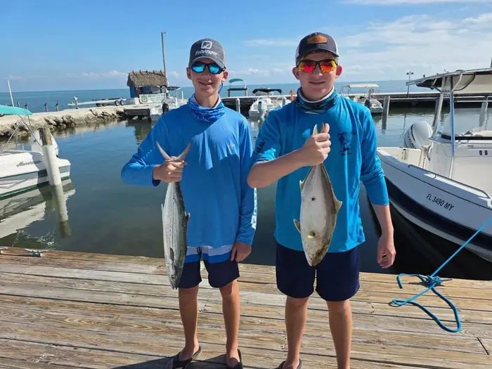 Young anglers with their catch at the Alligator Reef dock