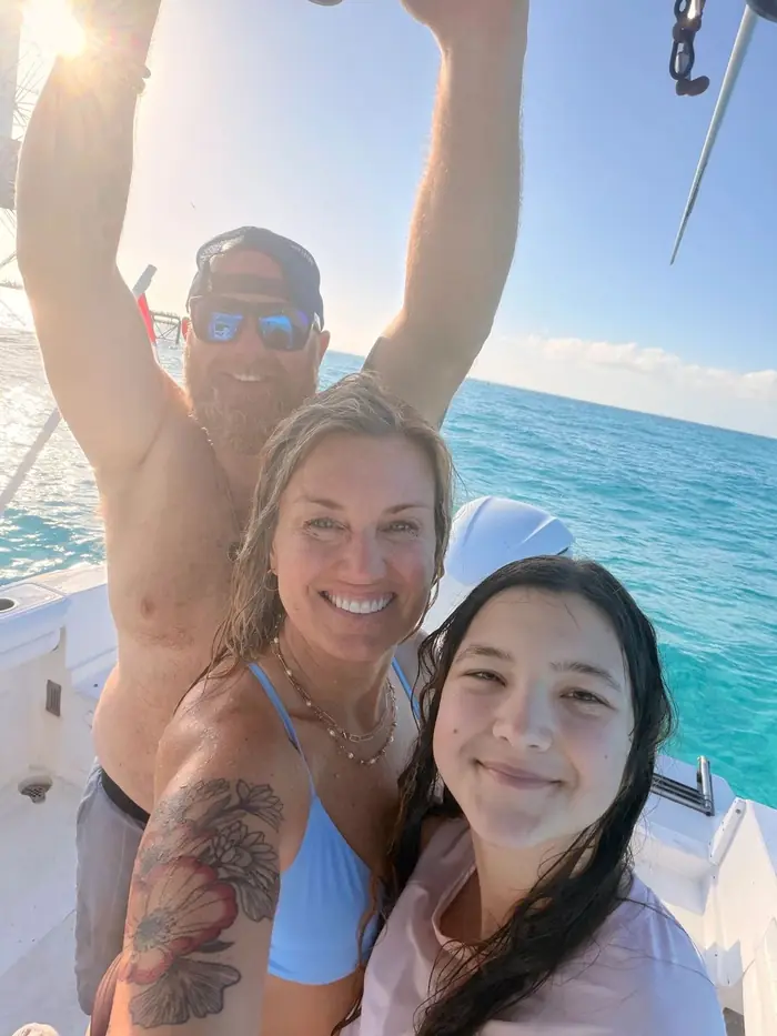 Couple at the sandbar with the rental boat