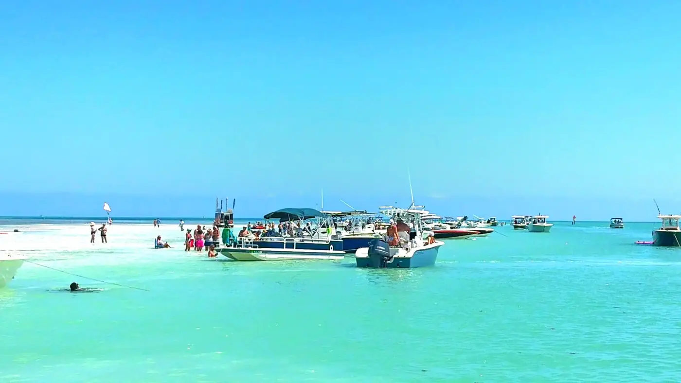 The Islamorada sandbar with boats anchored together in shallow turquoise water